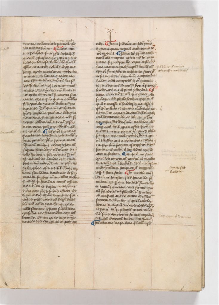 A vellum manuscript leaf has two narrow columns of dense dark handwriting, red and blue initials, ruled guide lines and notes in the wide margins.