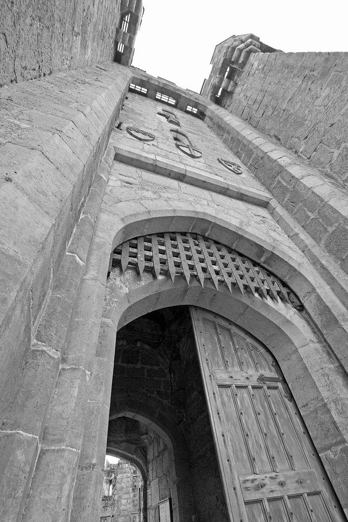 Bodiam Castle portcullis and machicolations, an architectural view.