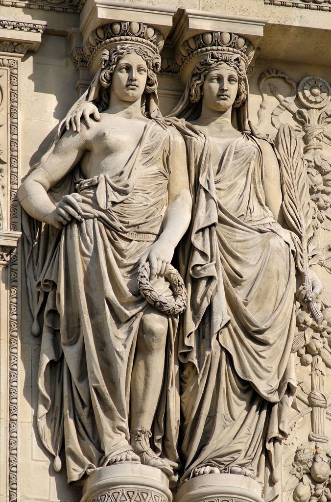 Two assembled caryatids supporting the pediment of the Pavillon Richelieu, Louvre, Paris.