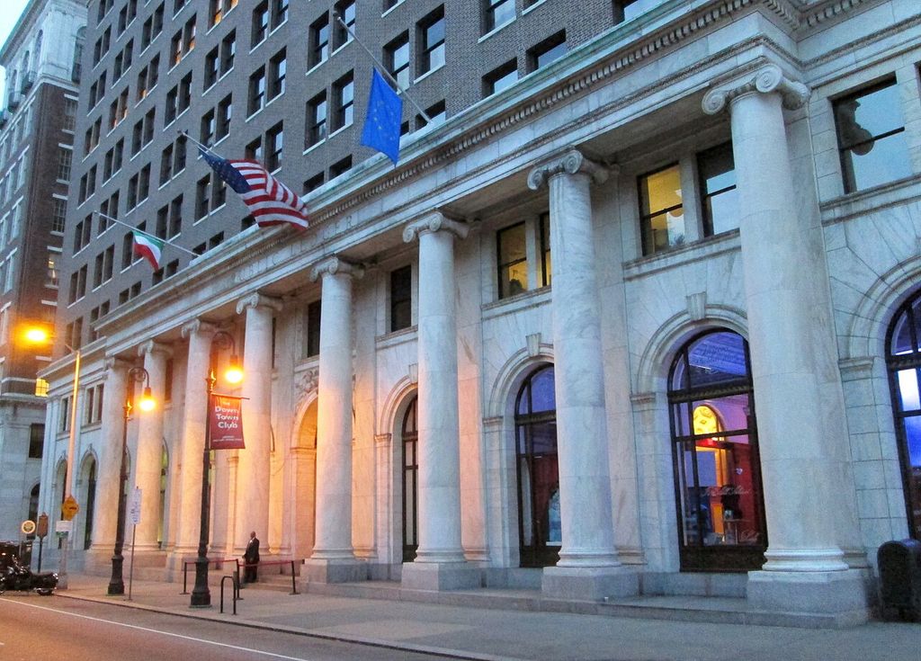 A long row of columns beneath the Public Ledger Building's portico at twilight.