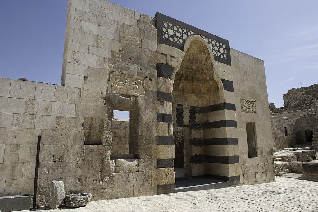 This monumental gate is at the entrance of a palace built by Ayyubid ruler al-Aziz in 1230, showing four iwan courtyard.