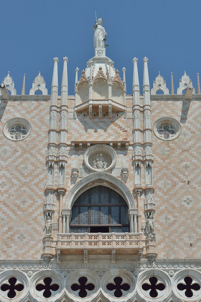 Loggia and statue of justice on the south facade of the Doge's Palace in Venice.