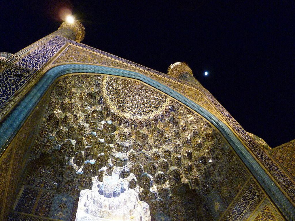 Entrance iwan muqarnas of Shah Mosque of Isfahan by night, Iran.