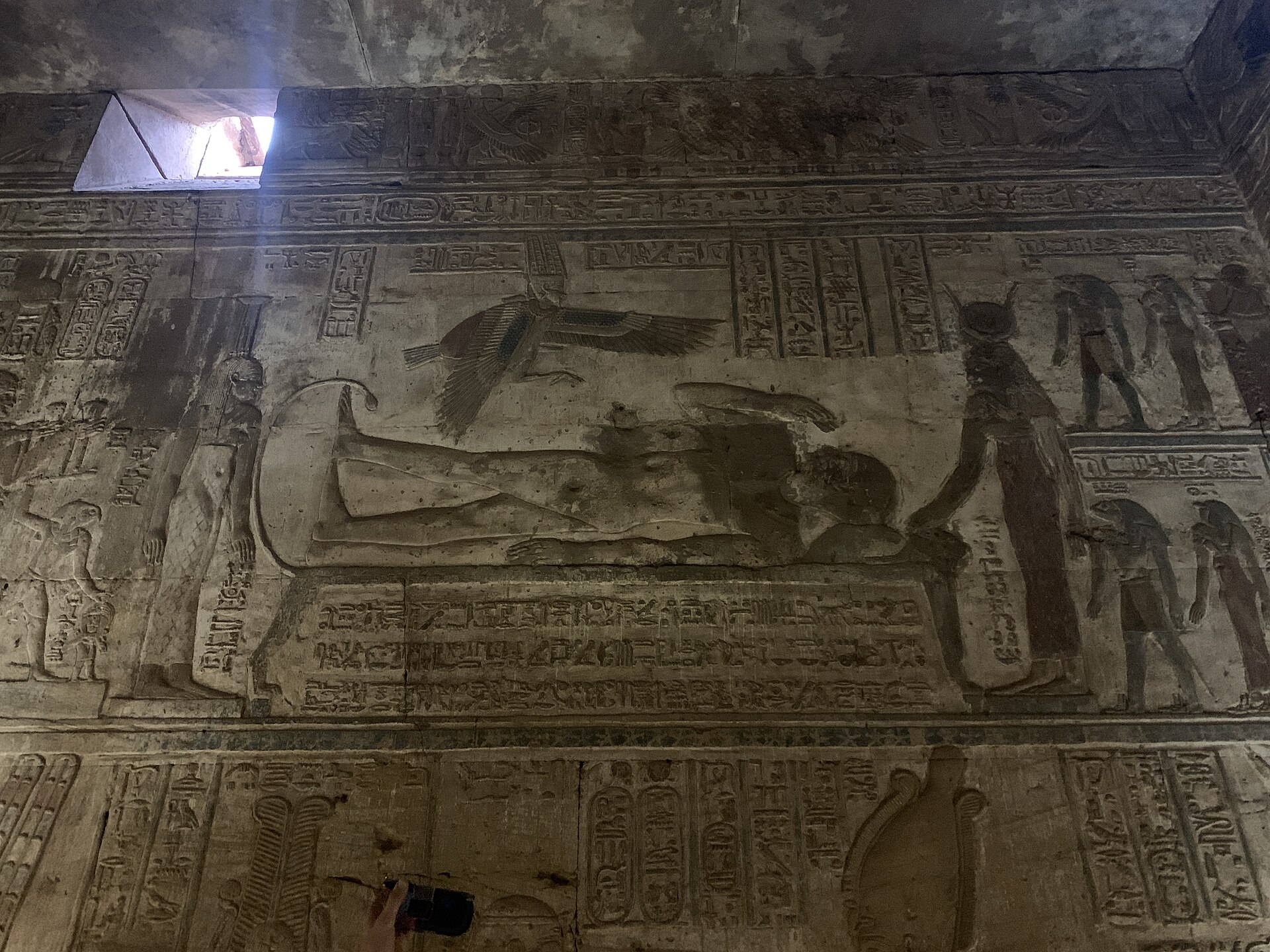 Painted and carved late Egyptian wall scene within a low roofed chamber of Karnak’s Opet Temple.