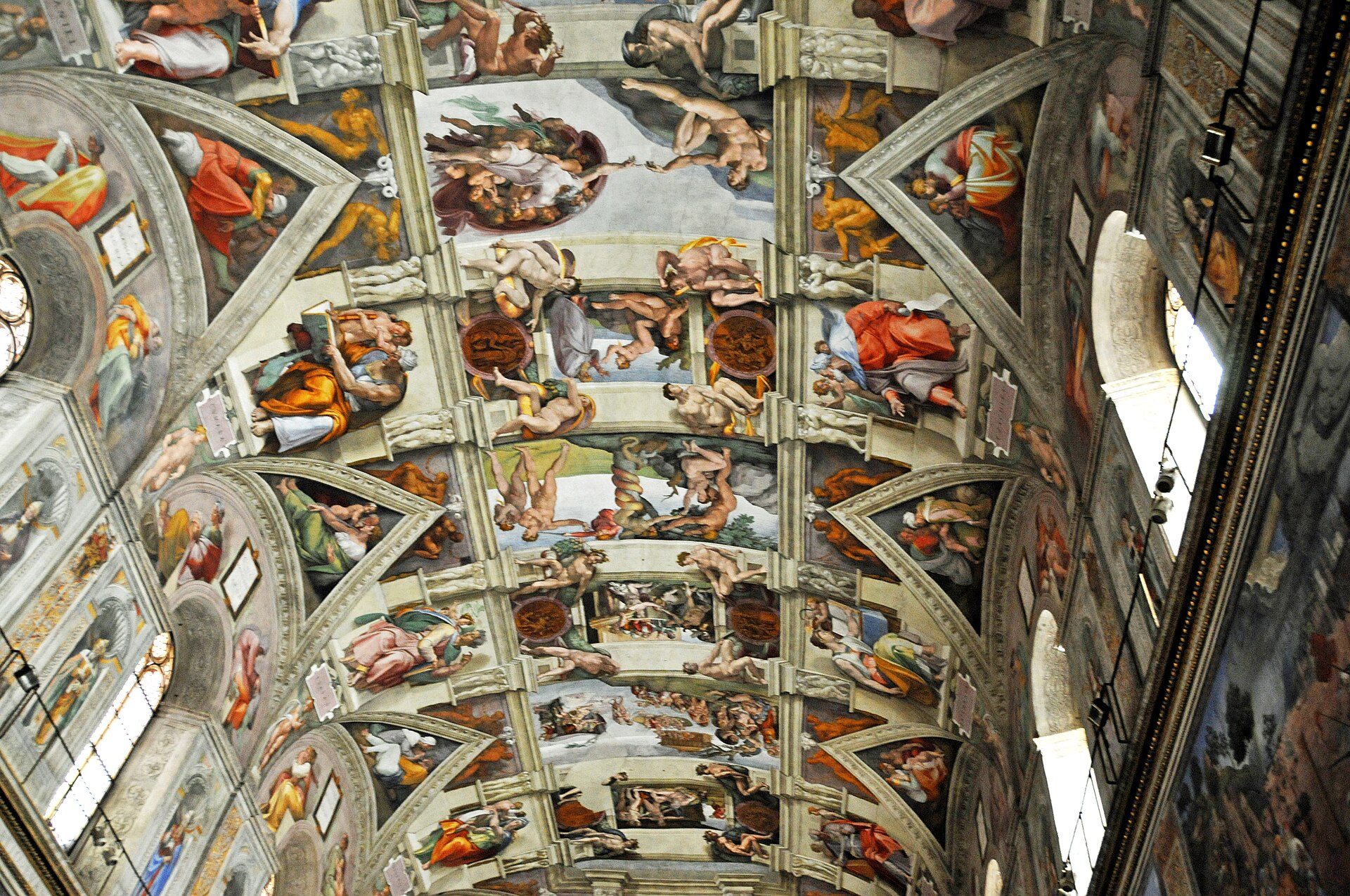 Oblique interior view of the Sistine Chapel showing Quattrocento wall frescoes, windows and Michelangelo’s painted ceiling.