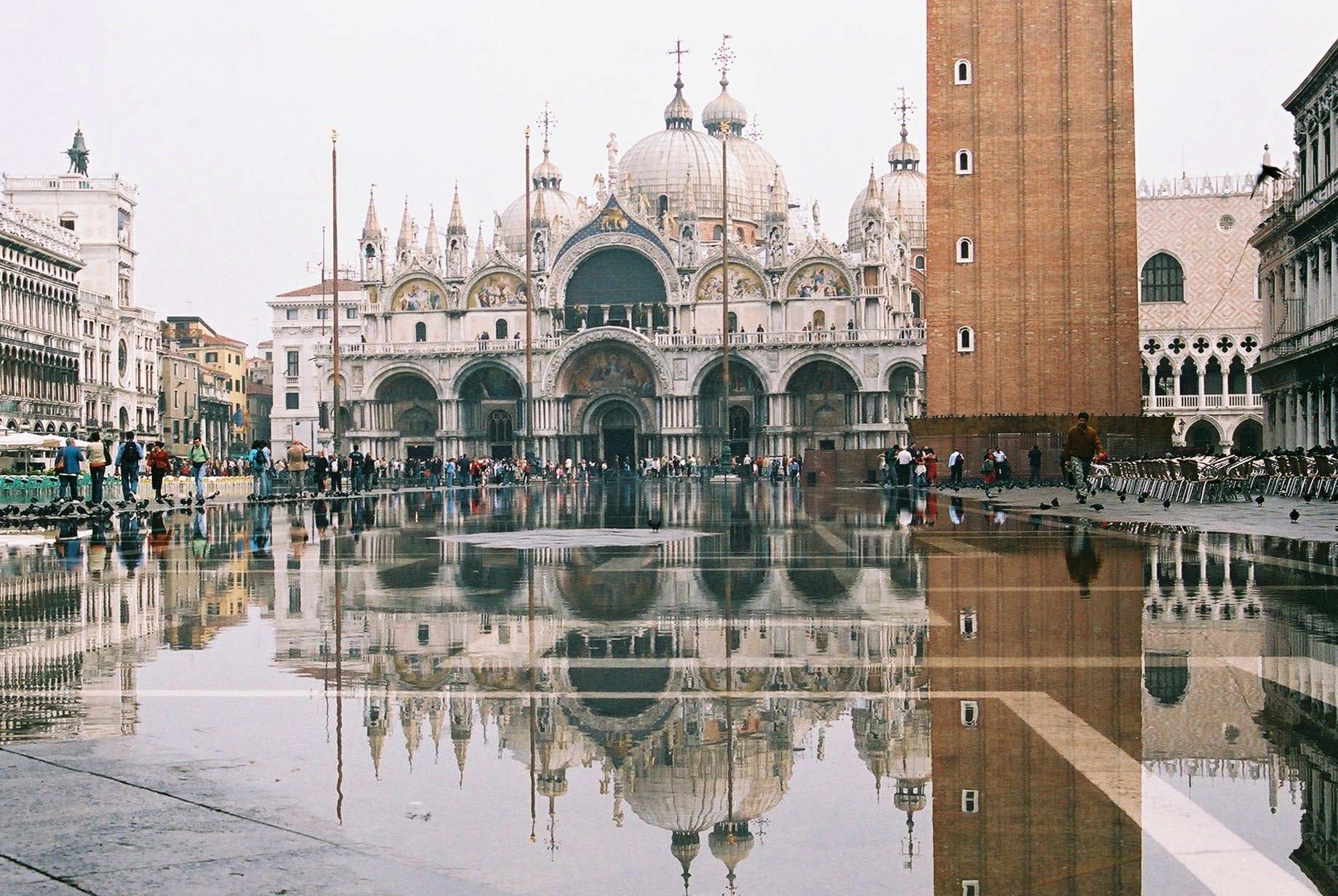 Flood water across Piazza San Marco reflecting the basilica and campanile.