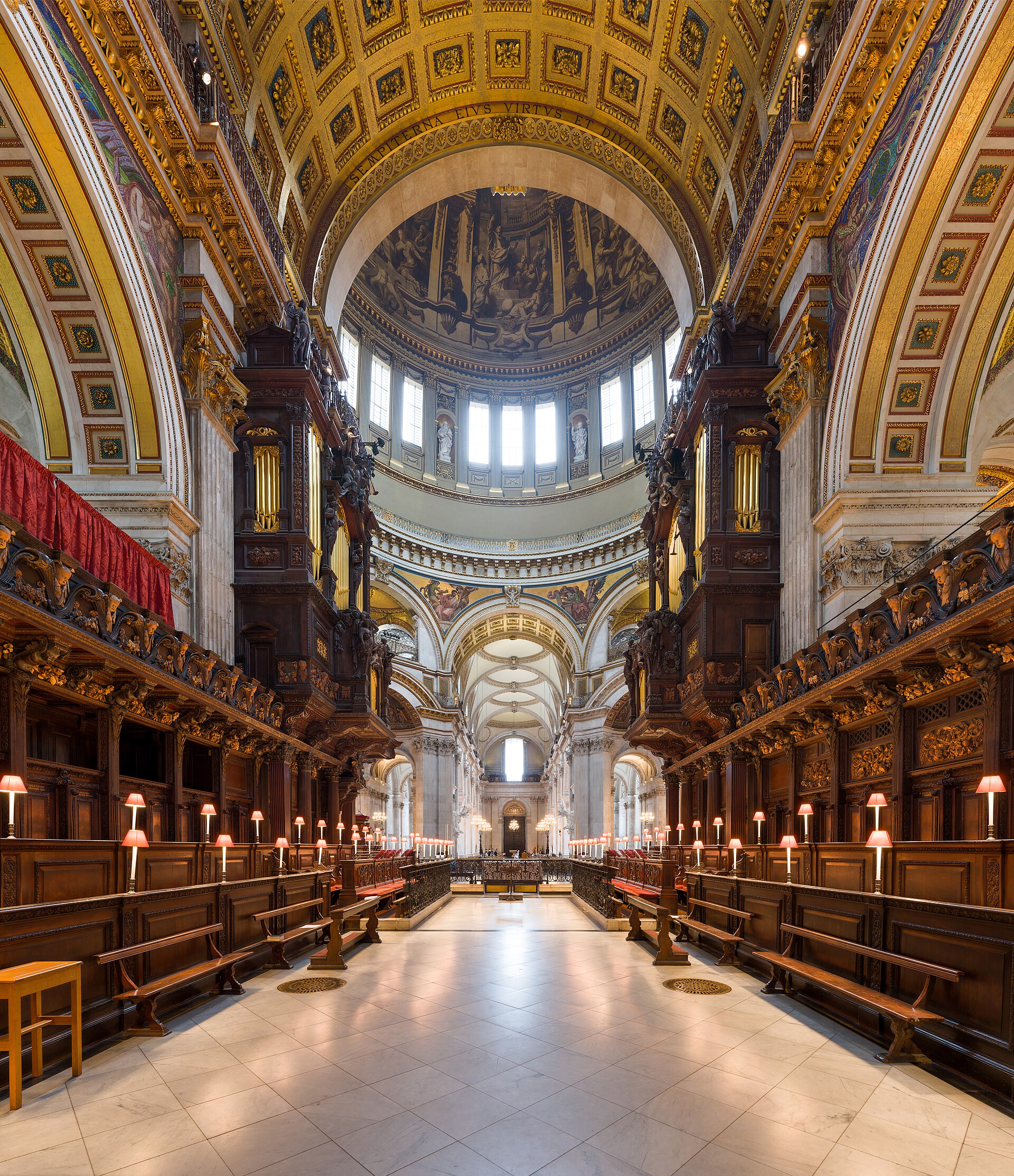 St Paul’s Cathedral choir looking west through carved dark-wood stalls and organ case towards the crossing and nave.