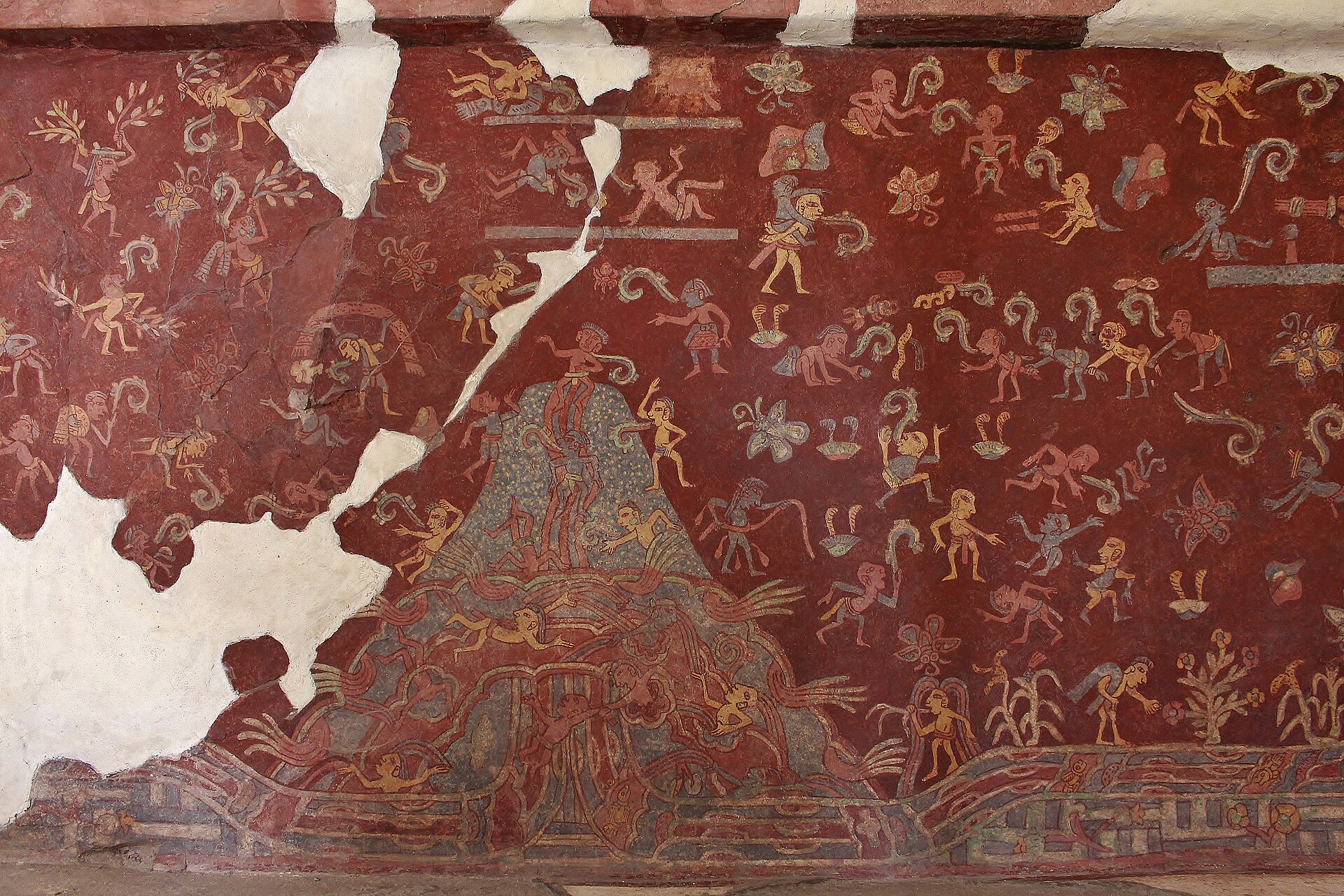 Broad surviving red-background Tepantitla mural with small figures, plants, flowing scrolls and several white losses.