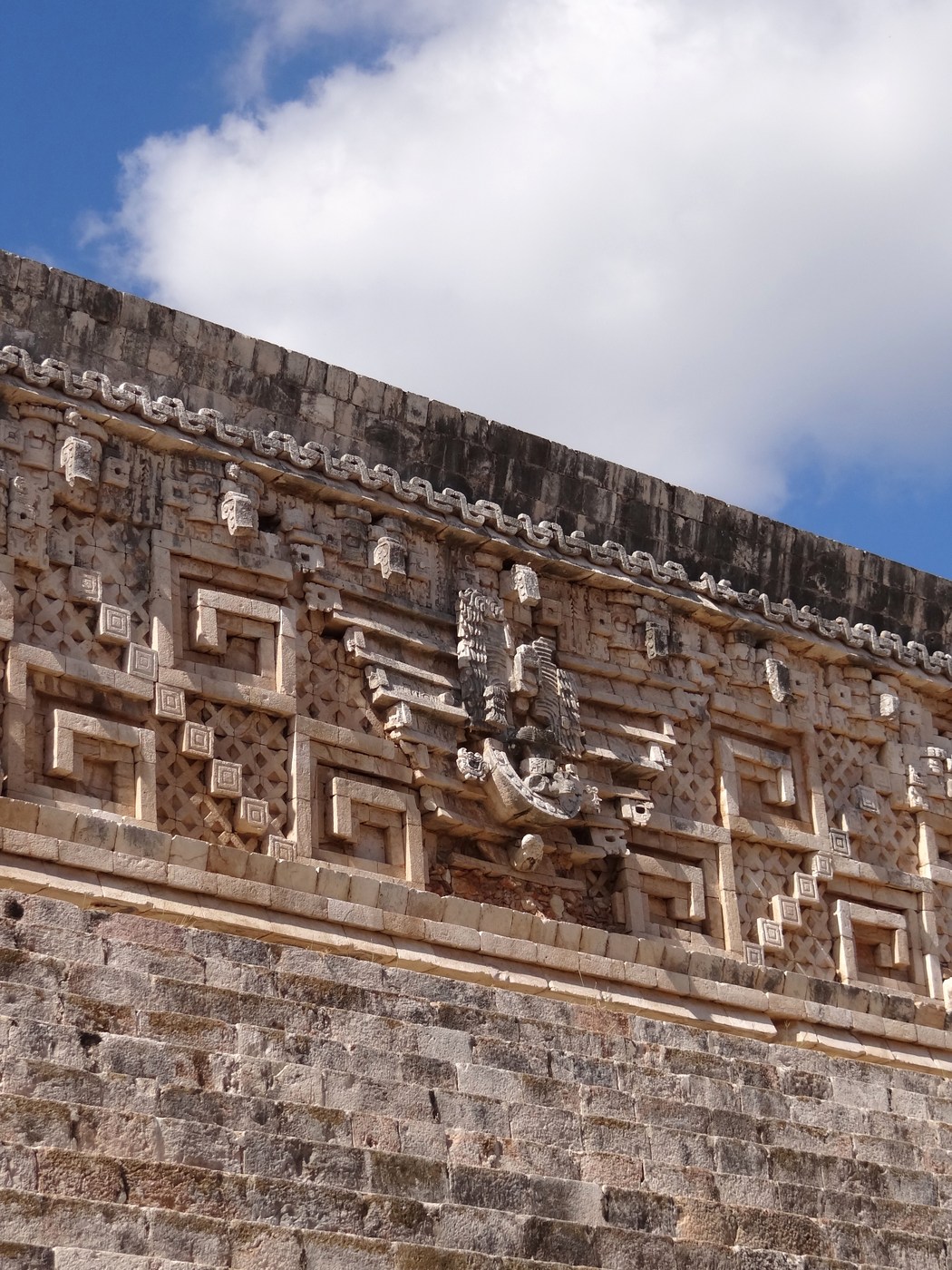 Lower stone courses and decorated upper components of the Governor's Palace at Uxmal.