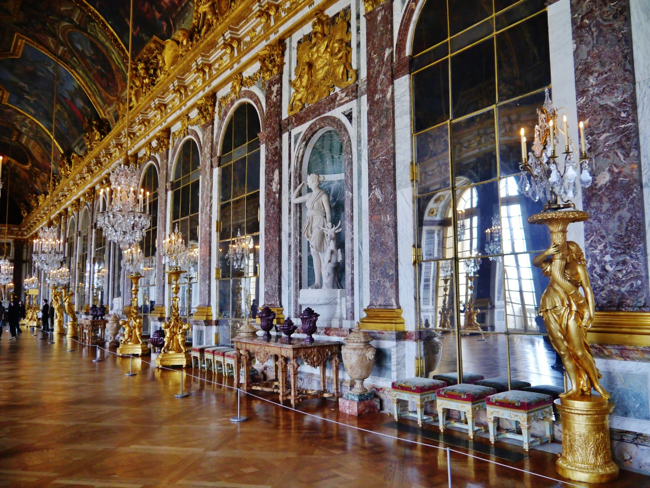 Tall mirrored arcades in the Hall of Mirrors reflect windows, visitors and the length of the room.