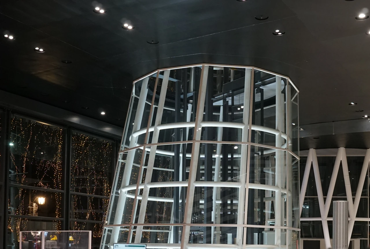 White members form an irregular tubular lattice beneath Sendai Mediatheque’s lit ceiling, with another lattice visible behind it.