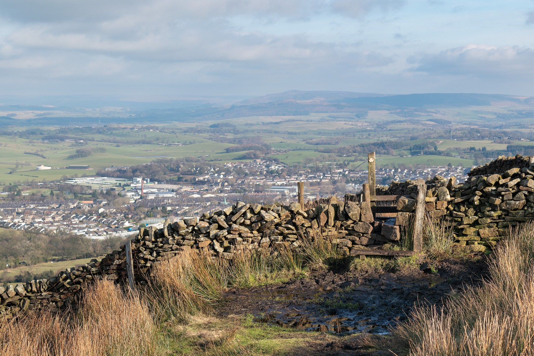 Irregular dry-stone wall and a stepped pedestrian stile on Weets Hill above Barnoldswick.