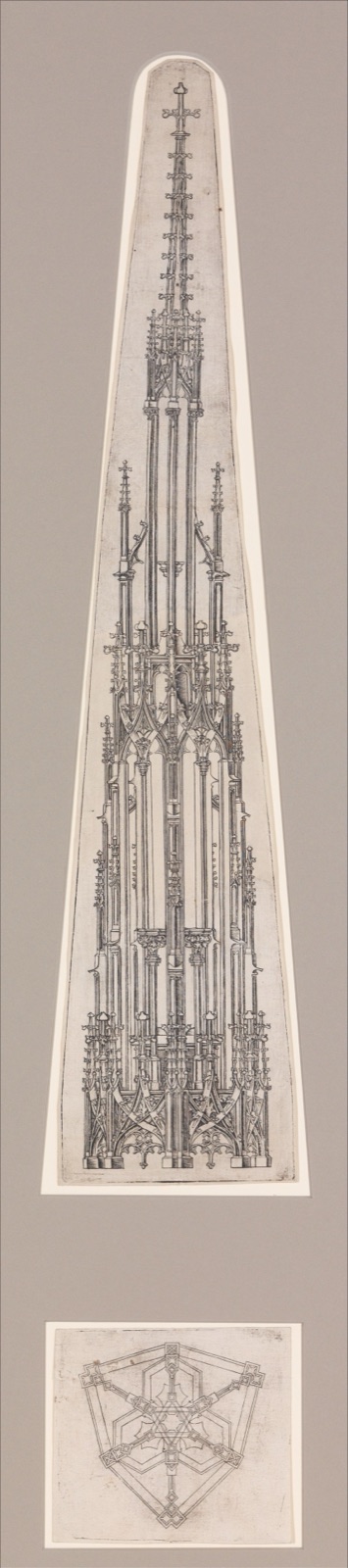 Tall engraved Gothic pinnacle with a small hexagonal plan underneath.
