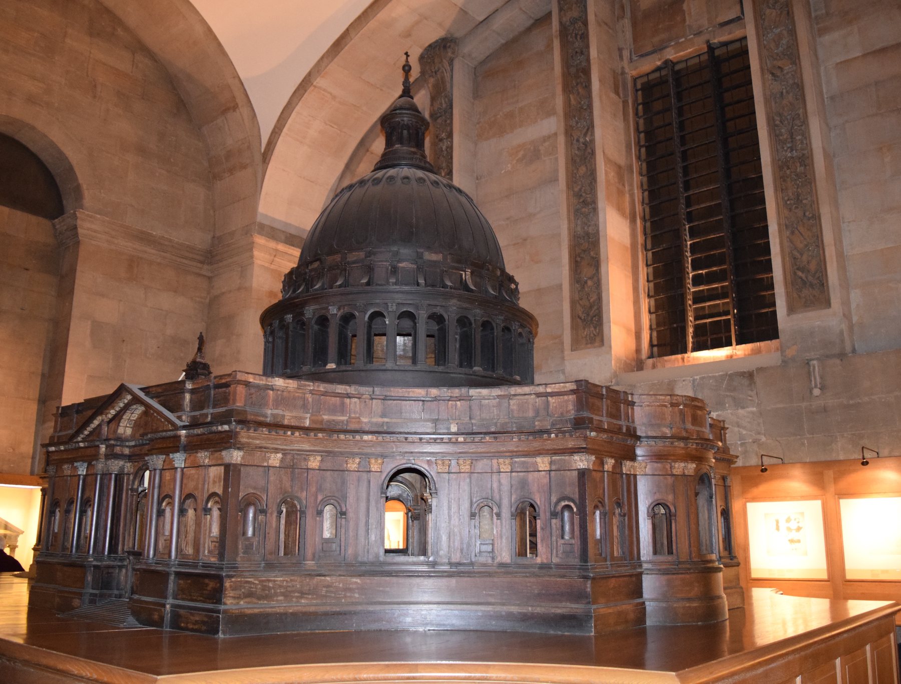 Surviving wooden St Paul’s Great Model displayed indoors, with timber walls and a prominent central dome.