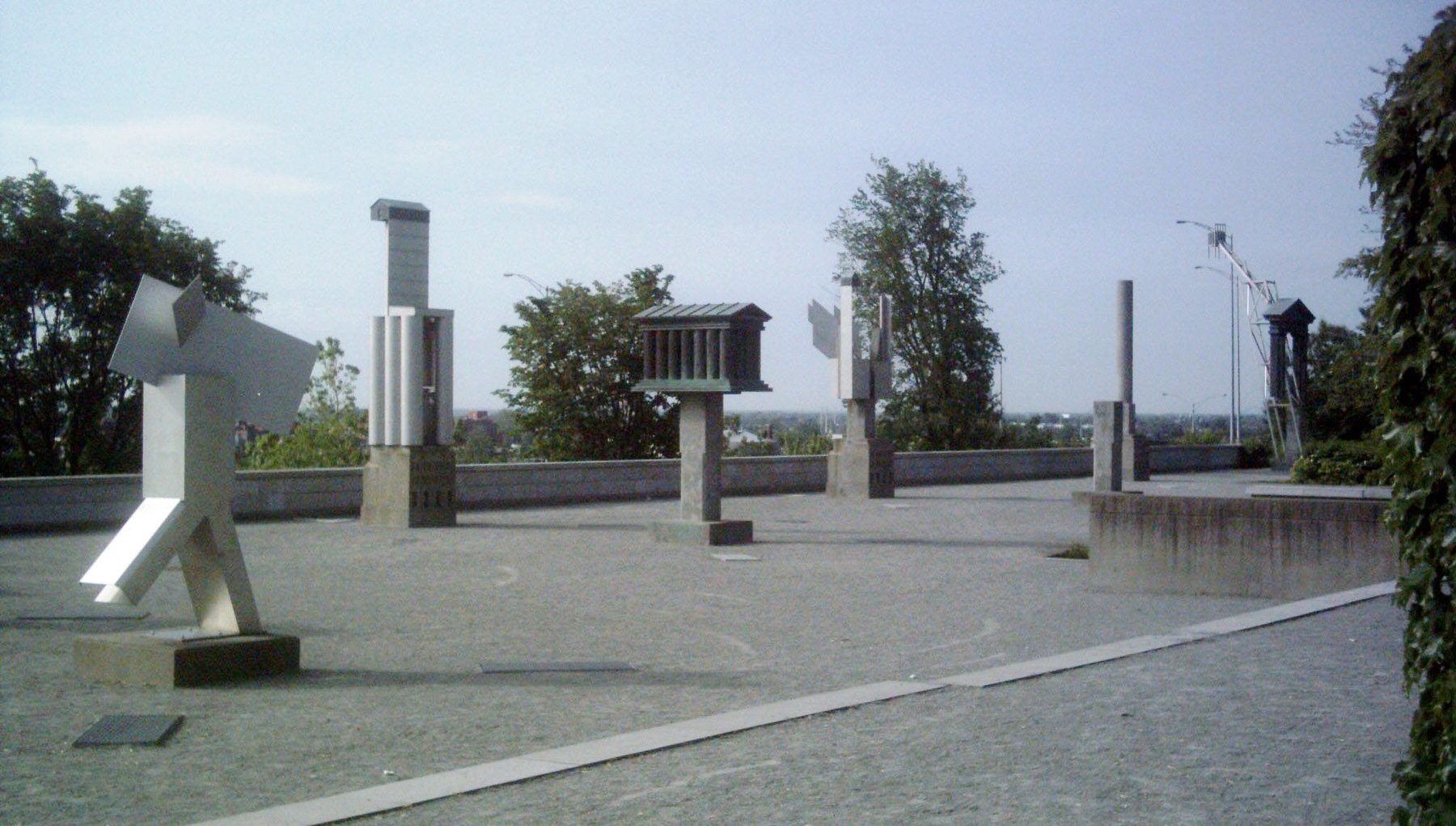 Public sculpture garden at the Canadian Centre for Architecture with geometric stone structures and surrounding planting.