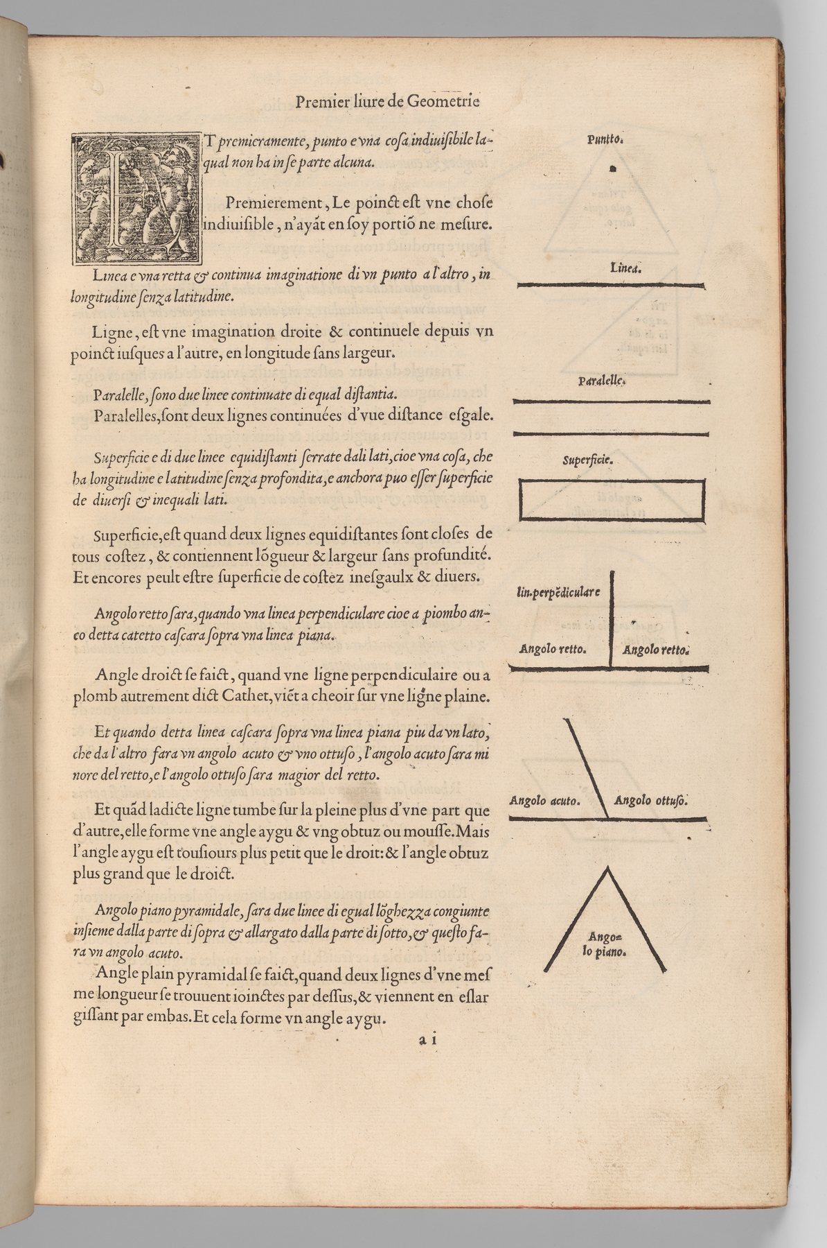 An open 1545 Serlio volume folio with alternating Italian and French geometry prose and small woodcuts of points and lines.