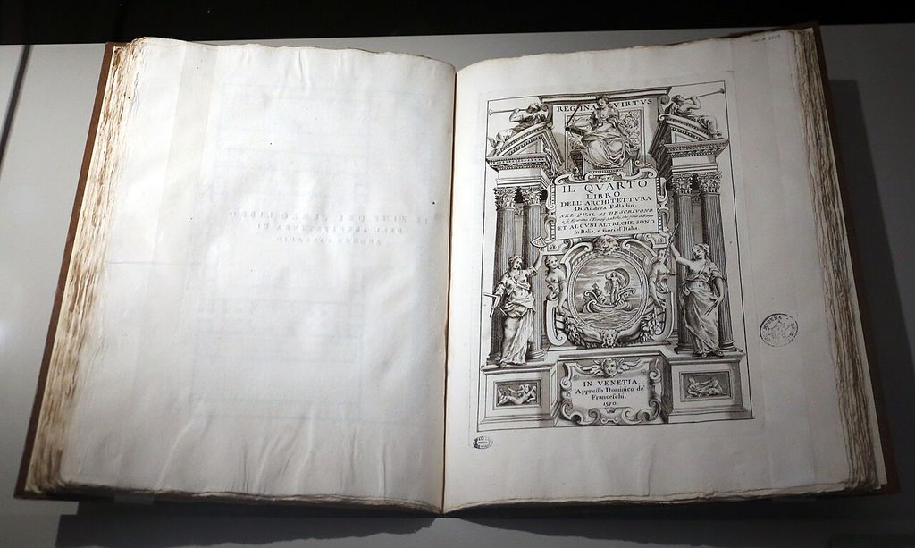 An open bound volume displays an engraved architectural title page naming Palladio and the year 1570.