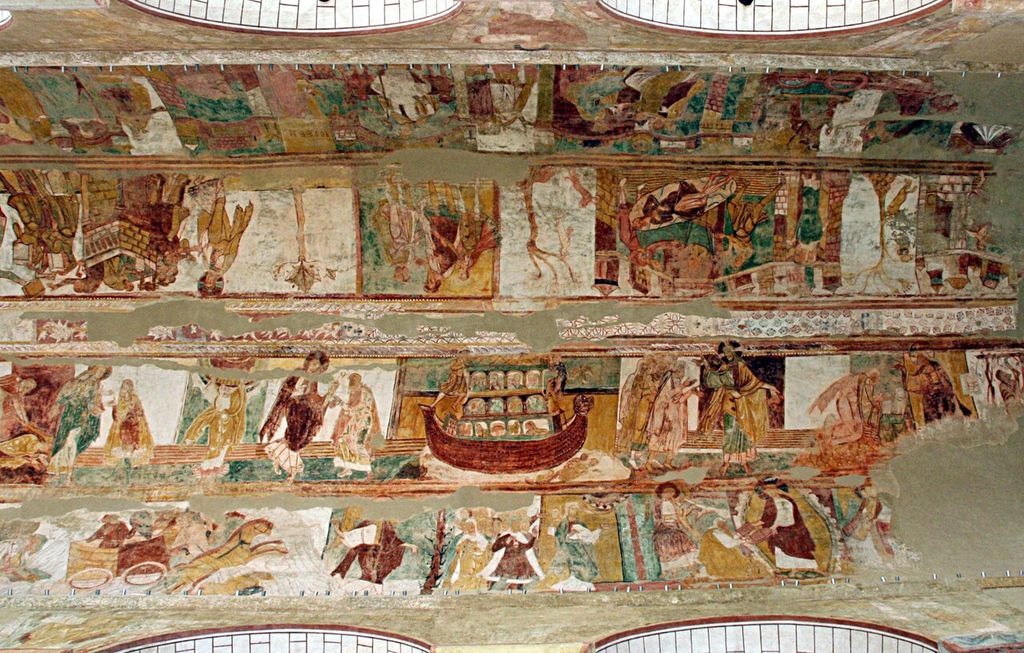 Rows of painted figures and scenes extend across the curved nave vault, interrupted by areas of lost plaster.