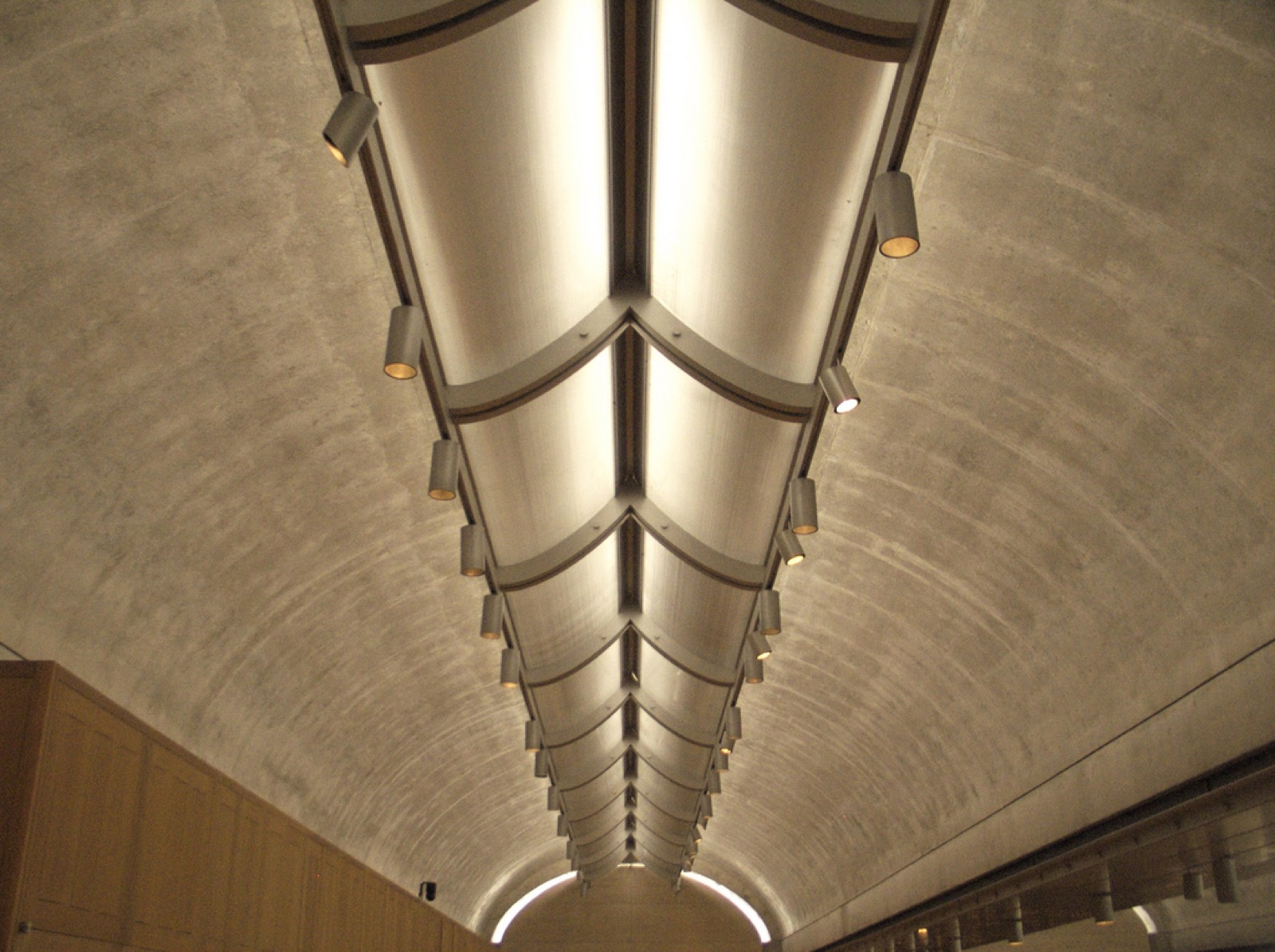 Looking upward along a Kimbell cycloid vault with continuous daylight reflector and repeating fittings.