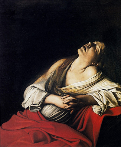 Mary Magdalene leans her head back above clasped hands, pale drapery and a red mantle against darkness.