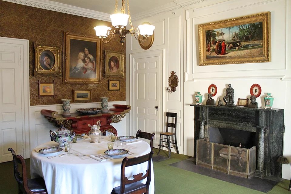 Dining room at Longfellow House–Washington’s Headquarters National Historic Site, 2018. The room reflects Alice Longfellow’s later arrangement; Johnson’s over-door drawings are outside this photograph, and the central family painting is not attributed to him. NPS Photo / Kate Hanson Plass. Public domain.