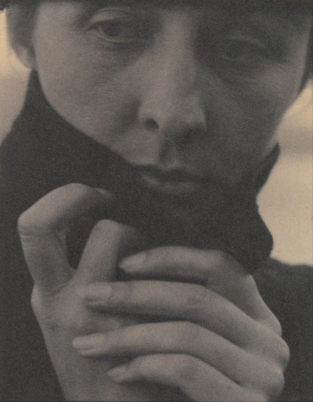 Historic portrait photograph: Georgia O’Keeffe close portrait with hands by Alfred Stieglitz.