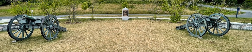 Cannon displays at Saratoga Surrender Site Memorial Park, 16 July 2022. Photograph by Kenneth C. Zirkel, via Wikimedia Commons, CC BY-SA 4.0. Whole supplied panorama resized only; a modern memorial view.
