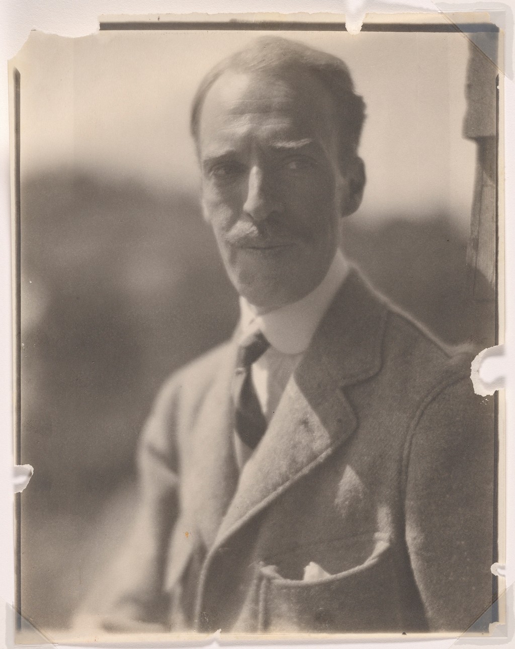 Duncan Phillips wearing a suit and tie in Clara Sipprell’s circa 1921 portrait.