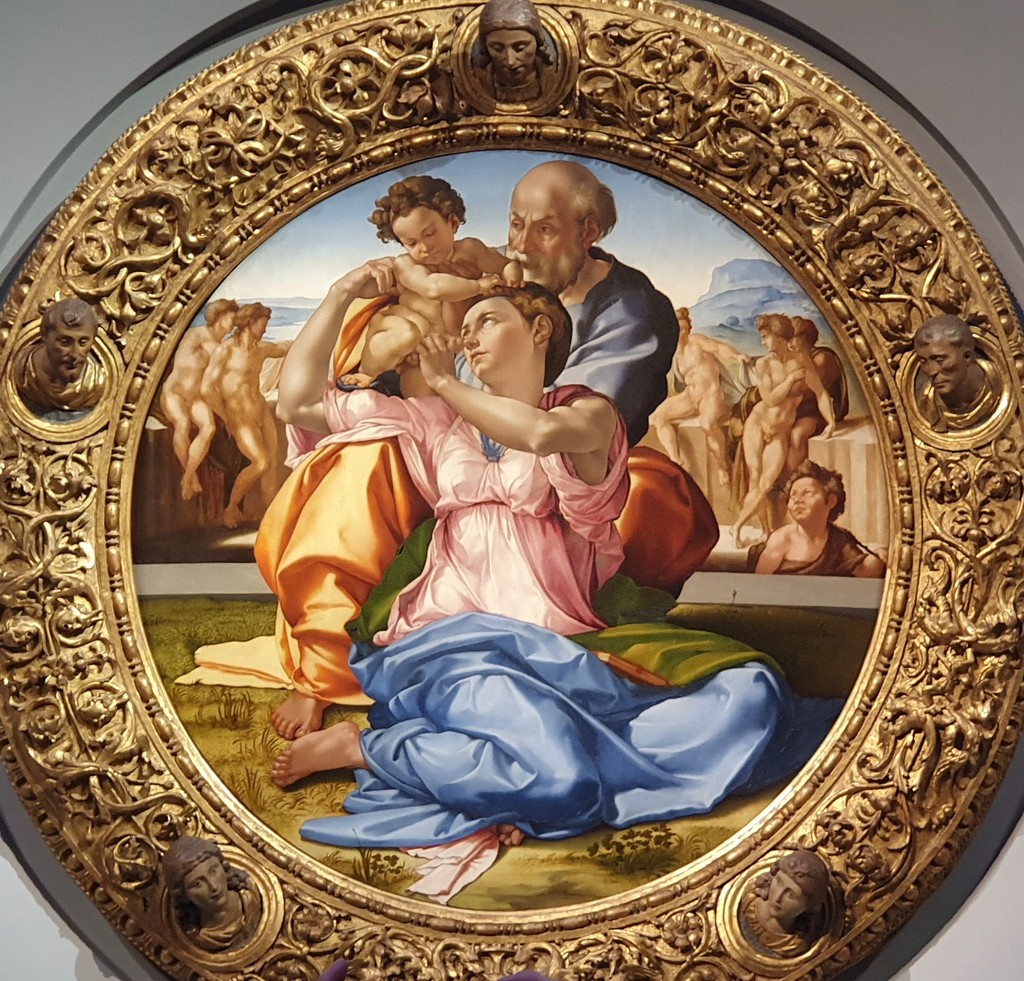 Michelangelo's Doni Tondo showing the Holy Family, background nudes and carved circular frame