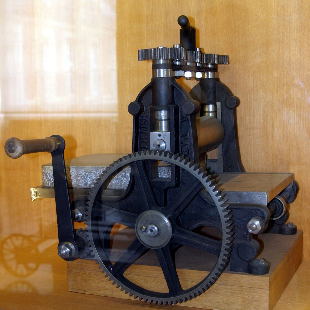 A lithographic press, showing the machinery used to transfer a prepared image onto paper.
