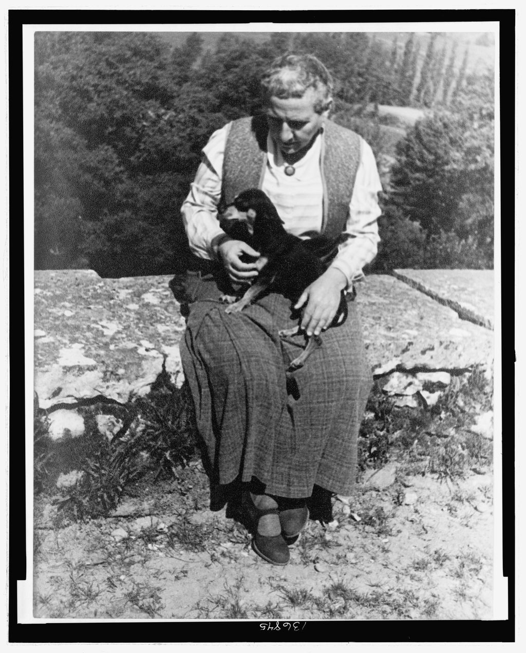 Gertrude Stein with her dog Pépé in 1934, photographed by Carl Van Vechten.