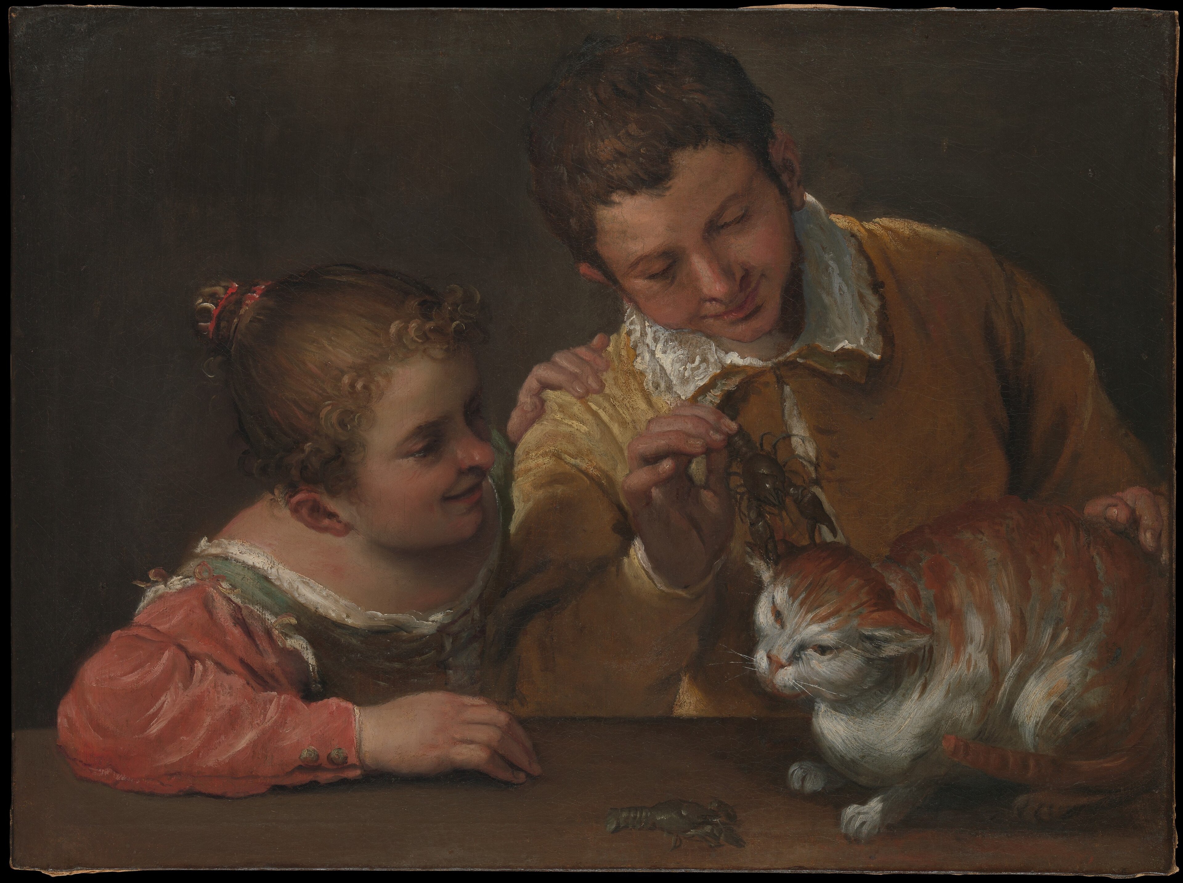 Two children lean over a table as one holds a crayfish above a crouching cat in Annibale Carracci's painting.