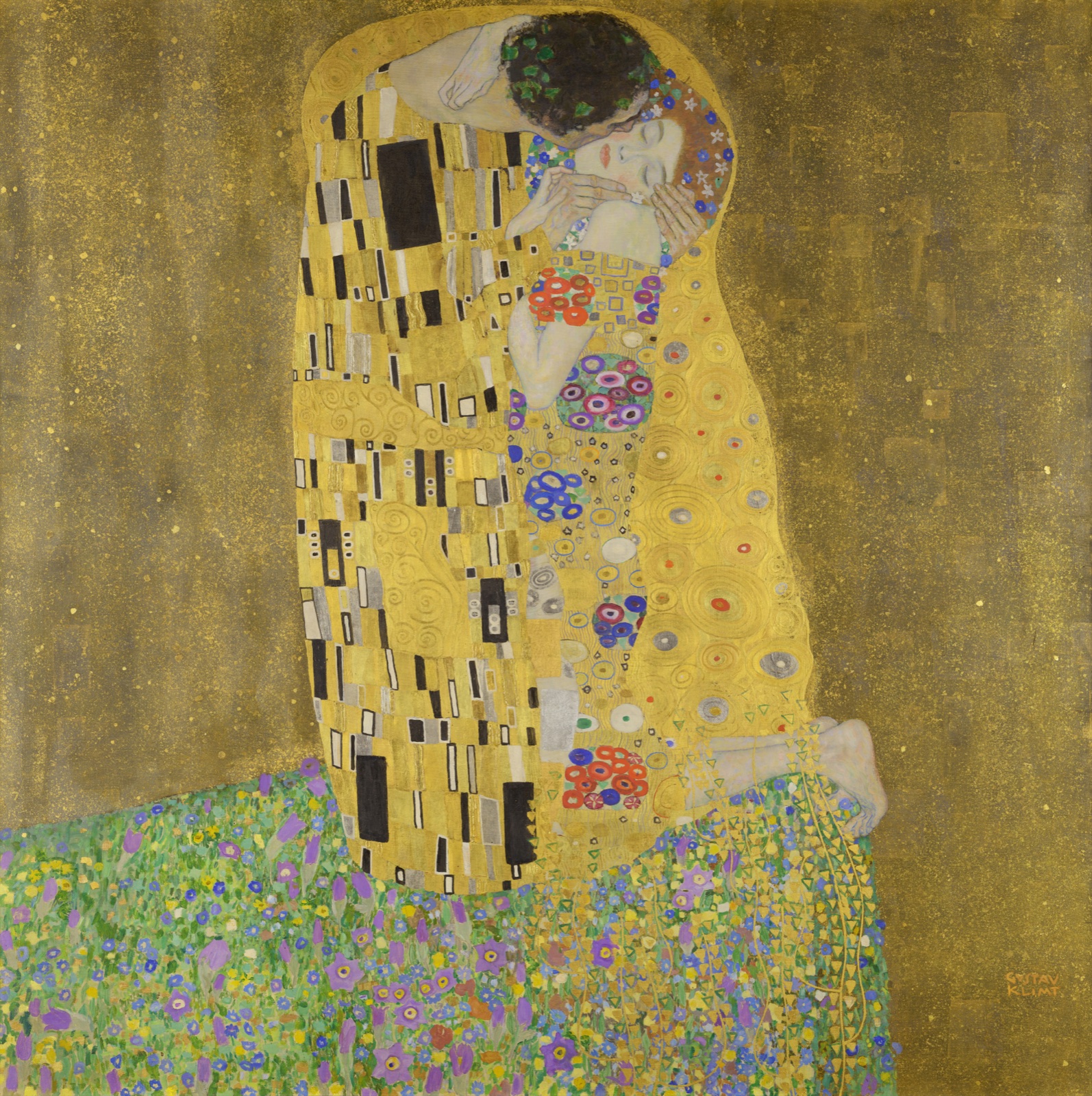 A couple embrace beneath patterned gold robes at the edge of a flowered meadow