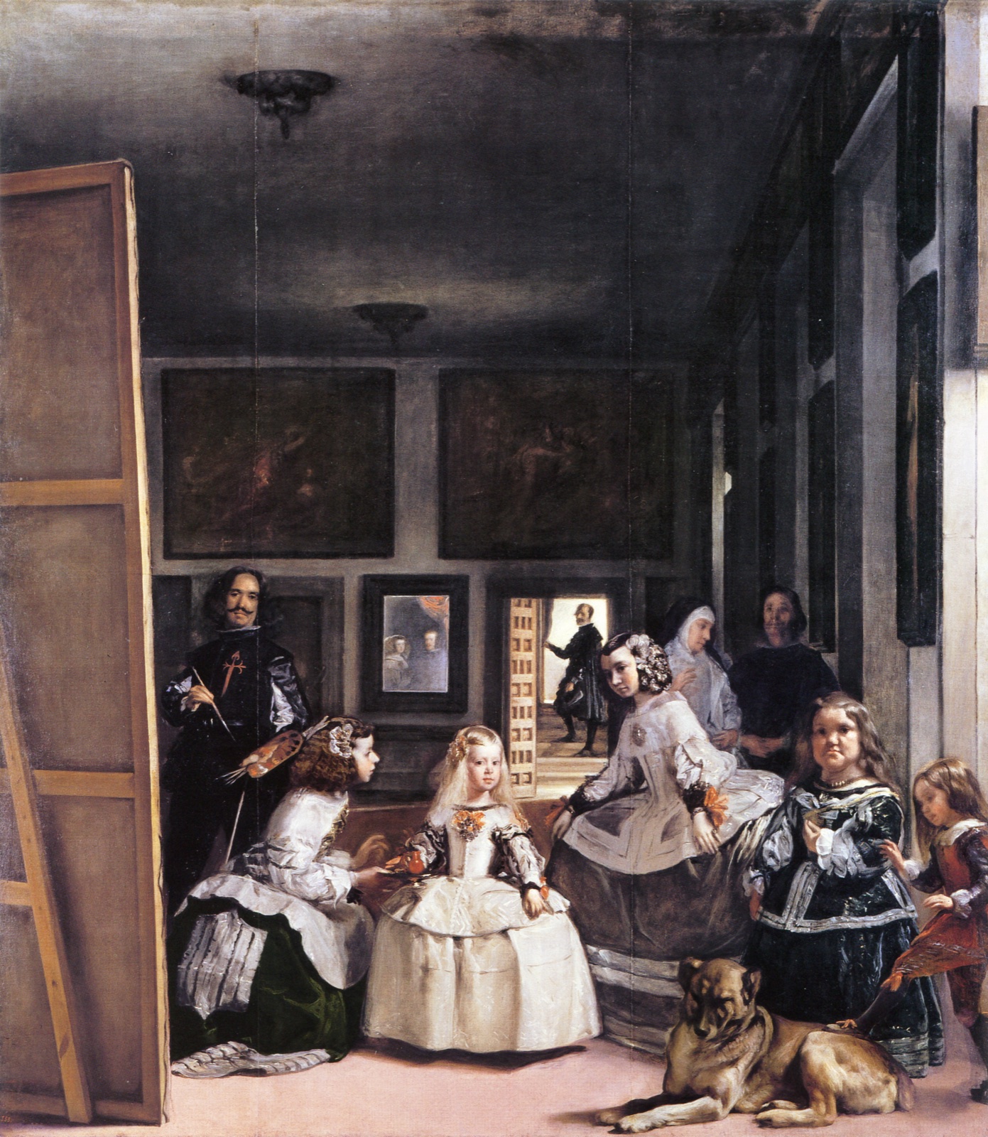 Infanta Margarita and attendants occupy a royal studio as Velázquez paints at left