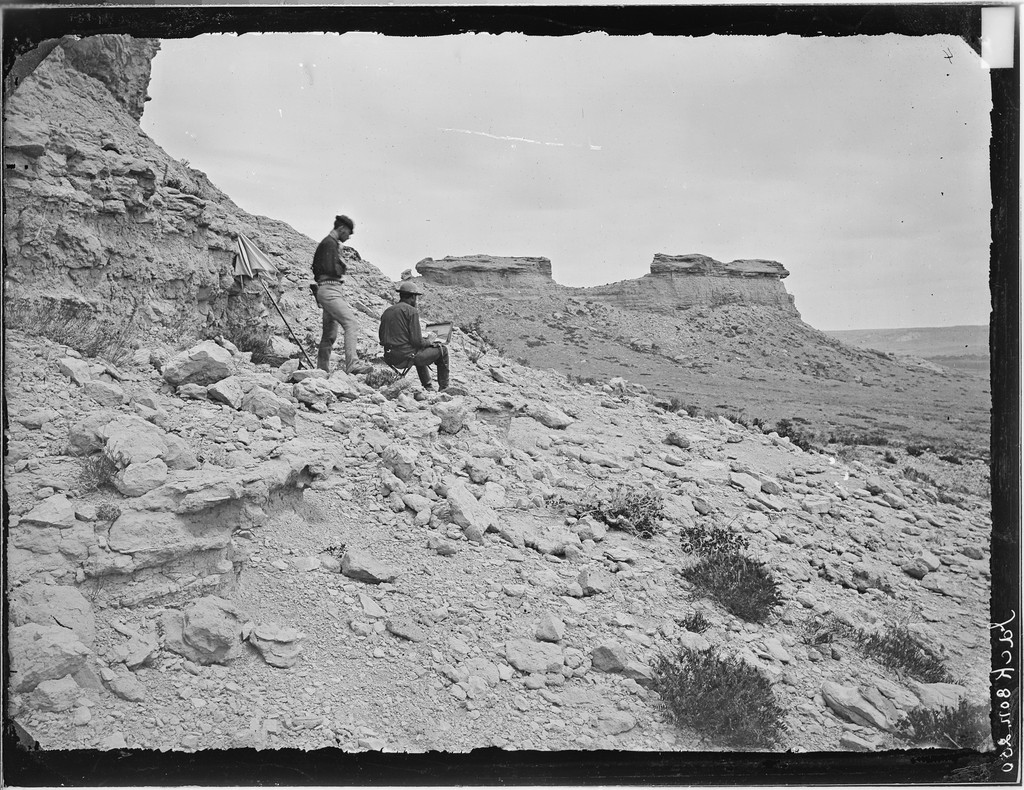 William Henry Jackson, Castellated rocks on the Chugwater. S.R. Gifford, artist, on right, 1870. Gifford is seated to the right of the unnamed standing companion.