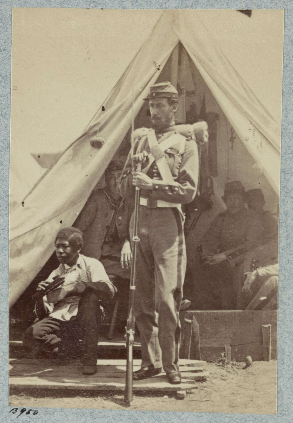 Unidentified photographer, 7th N.Y. State Militia, Camp Cameron, D.C., 1861. Photographed 1861; this albumen half-stereograph print dates between 1880 and 1889. Gifford stands beside an unnamed African American man shining shoes.