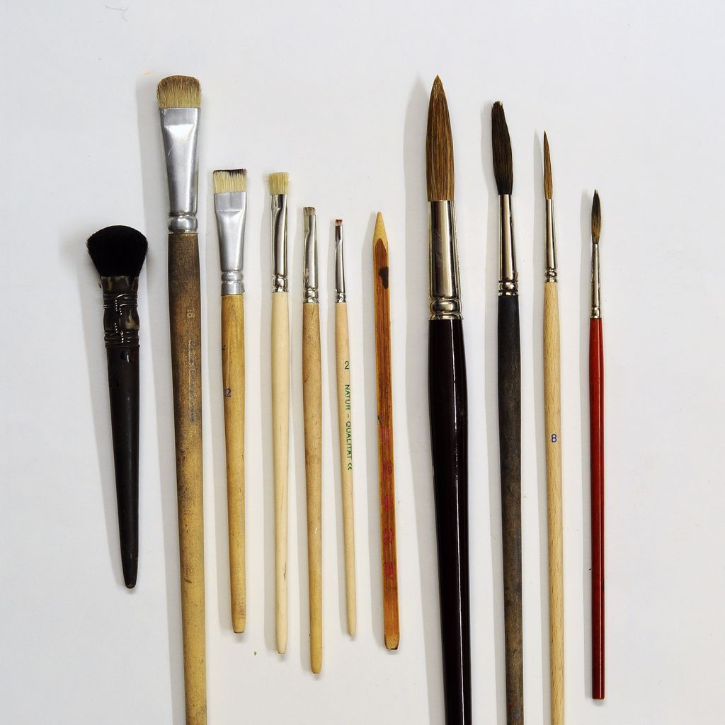 Array of artist brushes with rounded, pointed, flat, angled and fan-shaped heads.