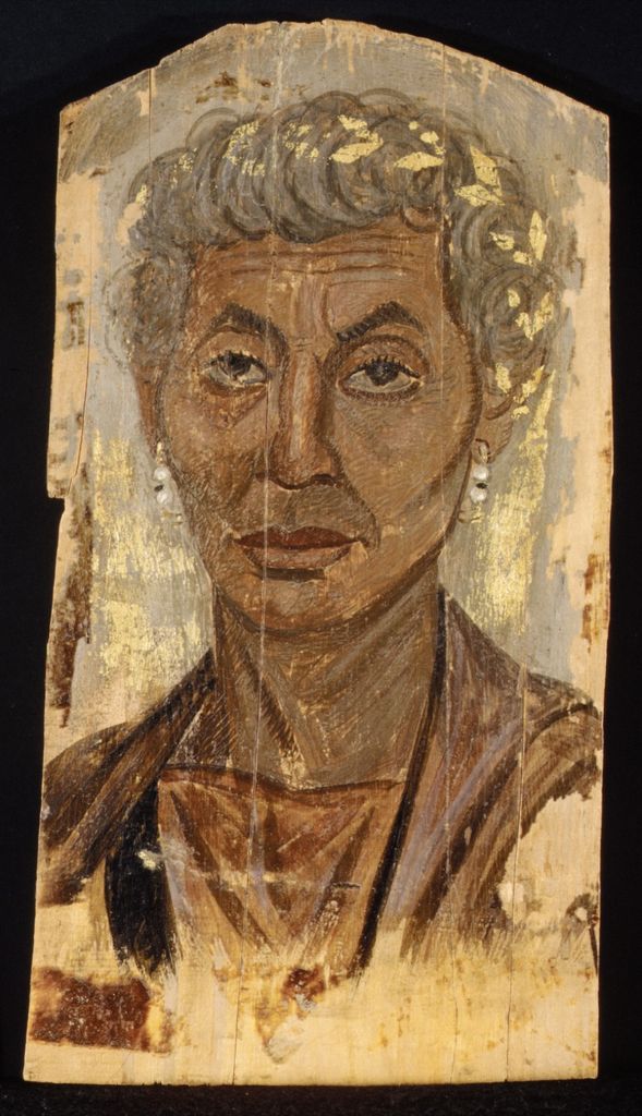 Encaustic portrait of an elderly woman wearing a gilded funerary wreath.