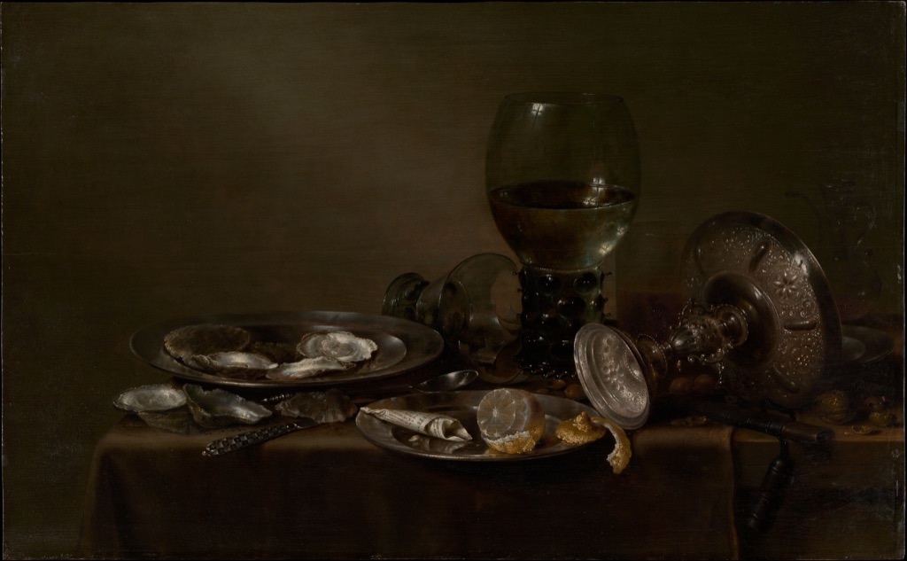 Heda's still life arranges oysters, glass vessels, silver dishes, a peeled lemon and cloth across a dark table.