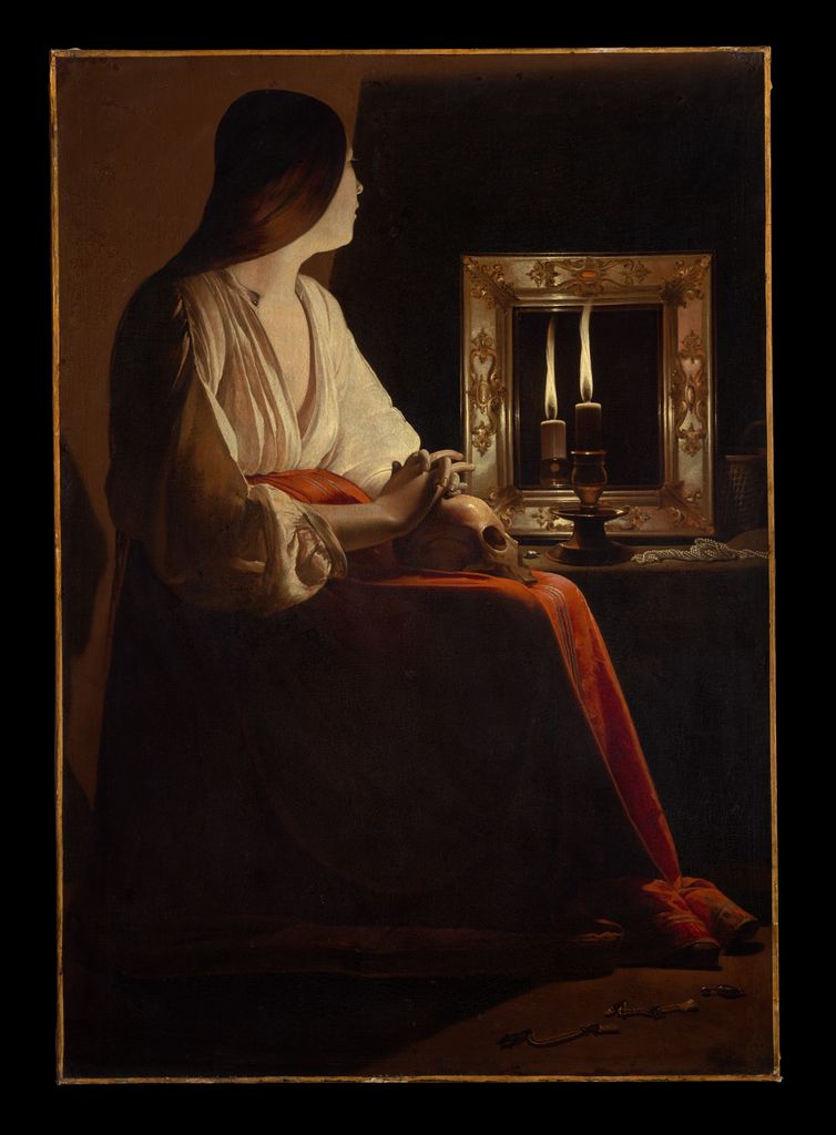 La Tour's Penitent Magdalen sits in profile beside a candlelit mirror with her hands resting on a skull.