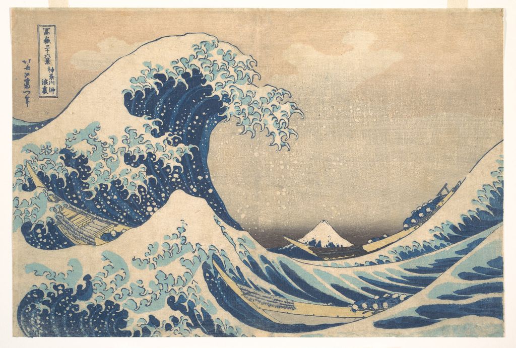Hokusai's Great Wave curls over three boats while Mount Fuji appears small on the distant horizon.
