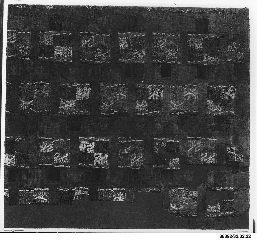 An Inca textile panel repeats rows of angular bird forms in a compact rectangular field.
