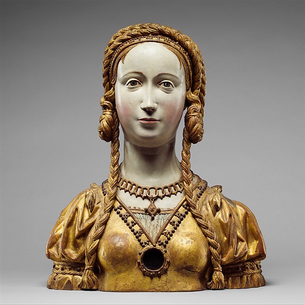 Painted and gilded oak reliquary bust of a richly dressed young woman.
