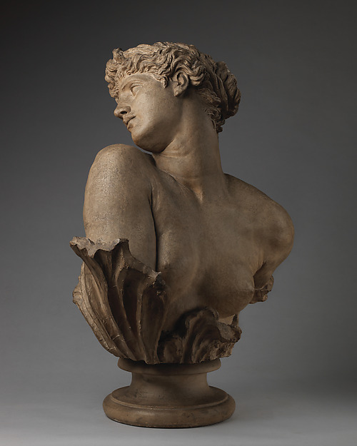 Painted plaster bust of Clytie twisting her head upwards over one shoulder.